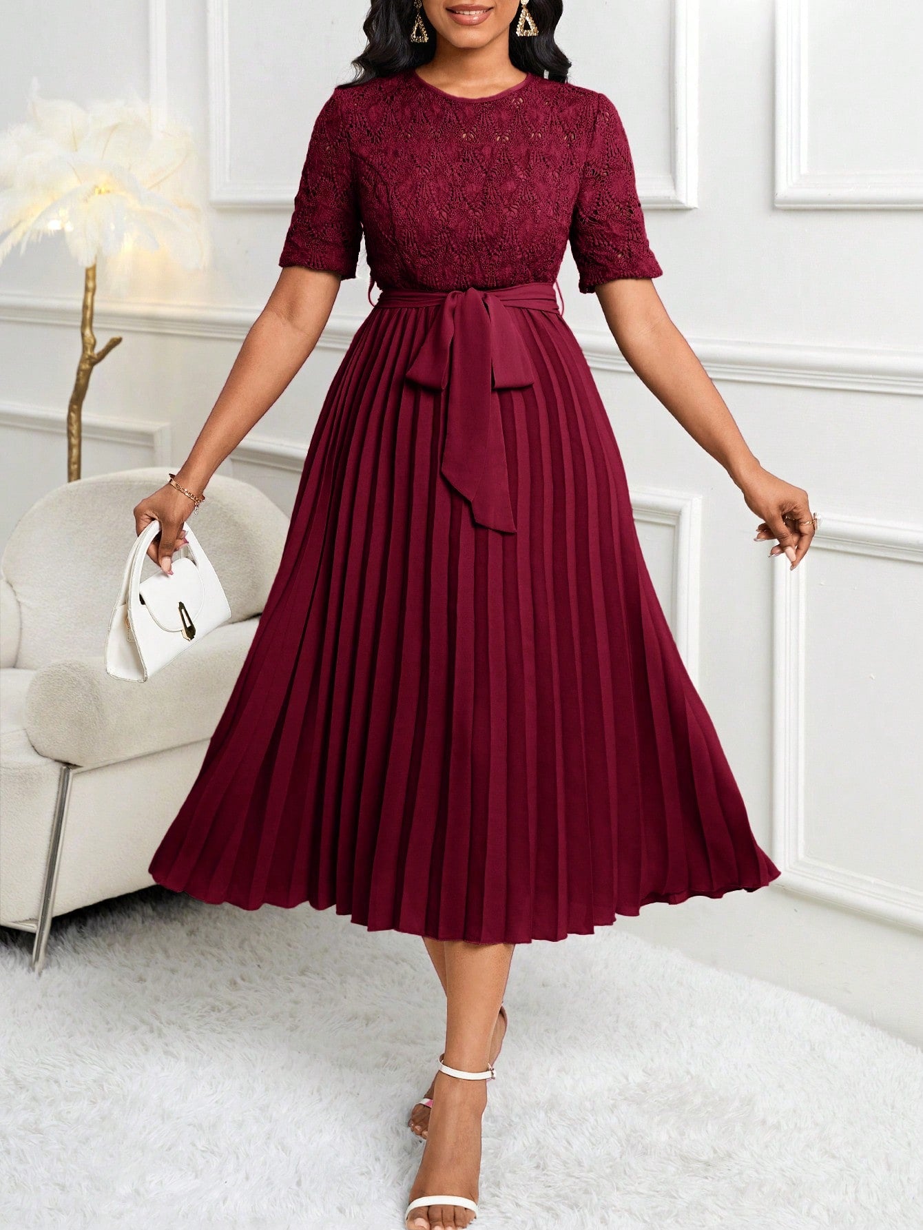 Dress to impress with this stunning water-soluble lace pleated wedding guest dress for women. The elegant design pairs perfectly with a belted waist for a flattering silhouette. Make a lasting impression at any wedding with this must-have dress.