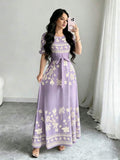 Elevate your summer wardrobe with this stunning watercolor floral long dress. Featuring elegant puff sleeves, a flattering high-waist A-line silhouette, and a belted design, this piece transitions seamlessly from vacation getaways to everyday elegance. The round neckline and flared hem create a graceful, feminine look perfect for any occasion. Crafted from a comfortable knitted fabric blend of 95% polyester and 5% elastane, this dress offers high stretch and a regular fit for all-day comfort. 