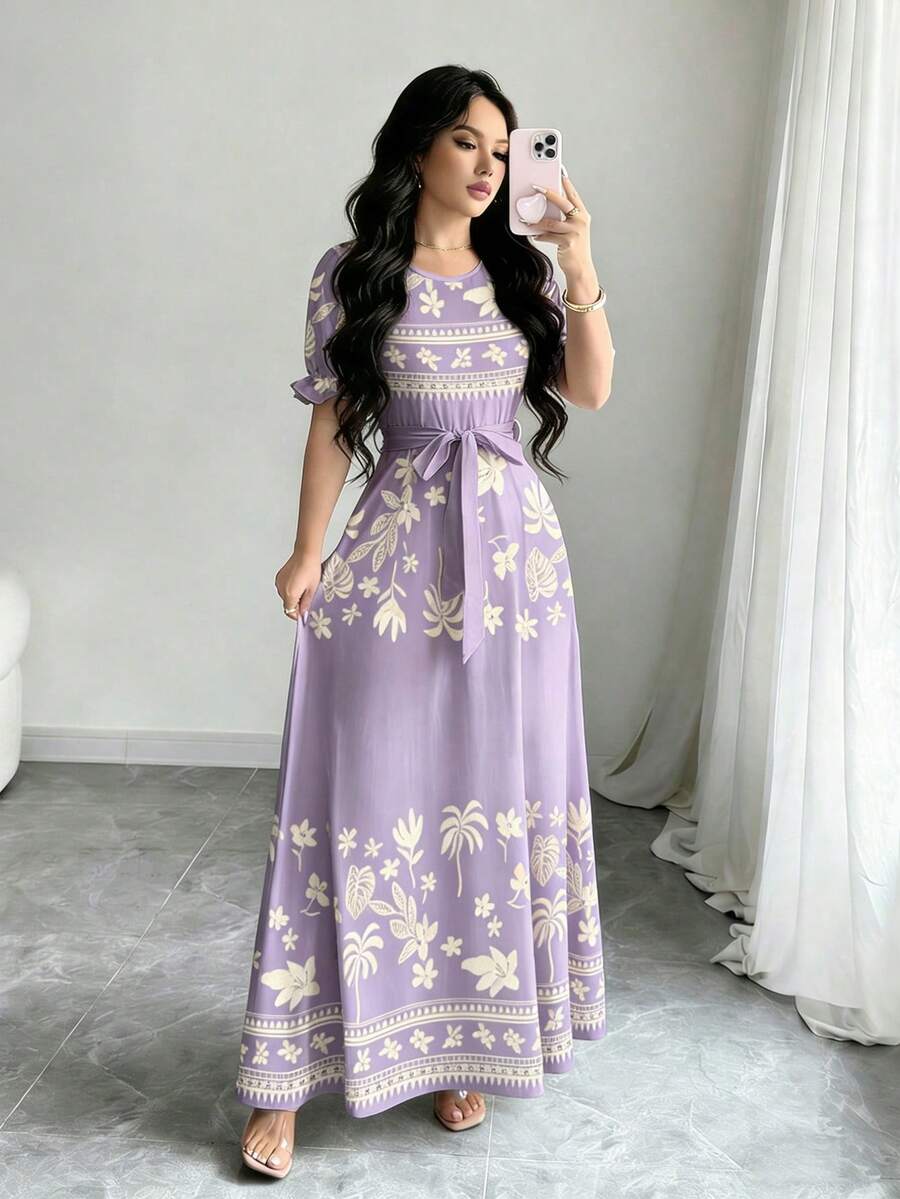 Elevate your summer wardrobe with this stunning watercolor floral long dress. Featuring elegant puff sleeves, a flattering high-waist A-line silhouette, and a belted design, this piece transitions seamlessly from vacation getaways to everyday elegance. The round neckline and flared hem create a graceful, feminine look perfect for any occasion. Crafted from a comfortable knitted fabric blend of 95% polyester and 5% elastane, this dress offers high stretch and a regular fit for all-day comfort. 