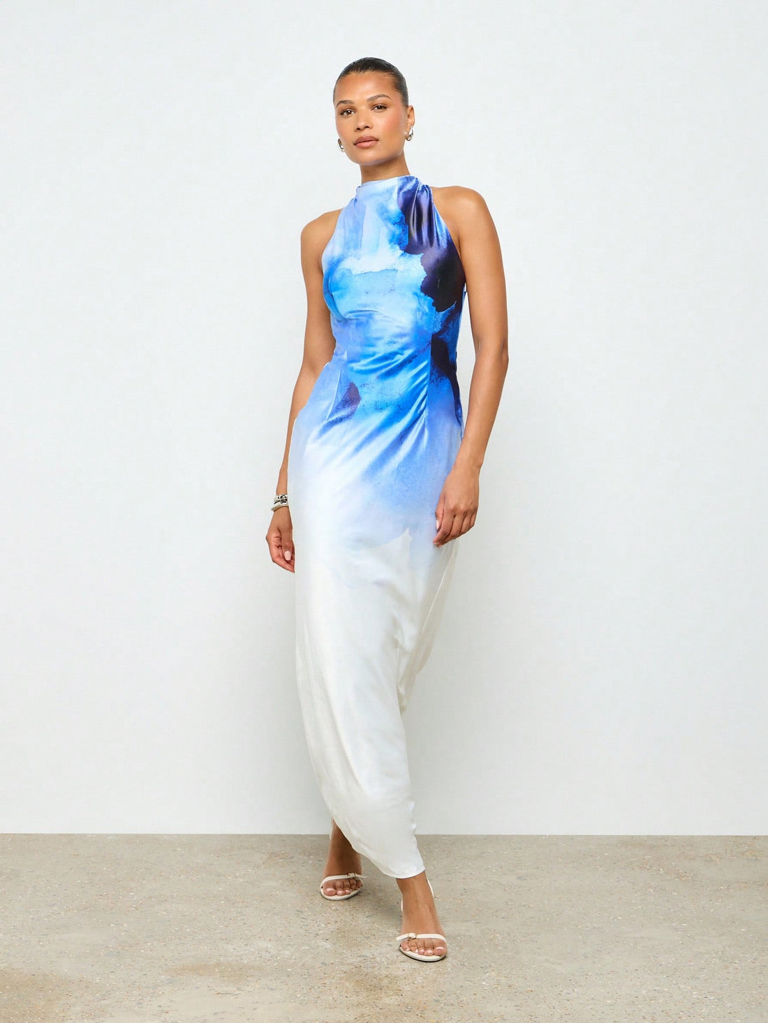 Dive into elegance with this stunning watercolor print maxi dress that's ready to turn heads at your next special occasion. The sleek sleeveless silhouette paired with a chic high neckline creates a sophisticated look that's perfect for summer weddings, formal events, and those moments when you want to feel absolutely fabulous. The flowing maxi length offers graceful movement while the artistic watercolor print adds a touch of whimsy and personality. Whether you're celebrating love or making a grand entranc