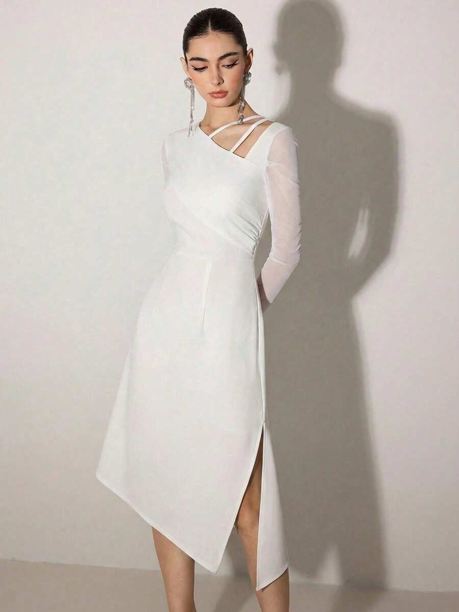 This sophisticated white cocktail dress features an asymmetric cold shoulder design that balances elegance with contemporary flair. The draped neckline creates a flattering silhouette while the off-shoulder cut adds modern appeal perfect for evening events, cocktail parties, or upscale gatherings. The clean white palette ensures versatility, pairing effortlessly with statement jewelry and heels. Crafted for refined occasions, this dress delivers polished style with an unexpected design twist that sets it ap