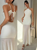 Timeless elegance meets modern sophistication in this stunning white halter maxi dress. The graceful backless design and flowing silhouette create an effortlessly romantic look perfect for summer weddings, beach celebrations, and special occasions. The halter neckline provides flattering support while the open back adds an alluring touch of drama. Crafted for comfort and style, this versatile piece transitions seamlessly from ceremony to sunset celebrations. An essential addition to any occasion wardrobe.