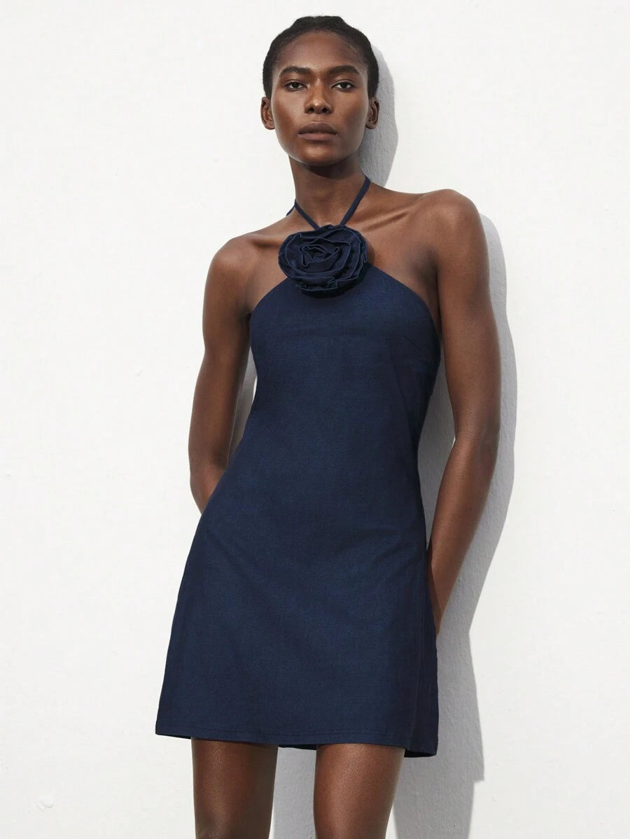 Turn heads effortlessly in this Elegant White Halter Neck Mini Dress, featuring a charming 3D rose collar that adds a whimsical touch. Its sleek silhouette suits every season and occasion, making it your go-to piece for playful yet sophisticated style. Whether it's a sunny brunch or a sparkling evening event, this dress promises to make you bloom with confidence.