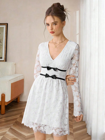 Elevate your fall wardrobe with this stunning white lace dress that's equal parts sophisticated and flirty. The plunging V-neckline draws the eye while the cinched waist creates a flattering silhouette that celebrates your curves. Delicate lace detailing adds romantic charm, making it perfect for date nights, brunch dates, or any occasion where you want to turn heads. Layer it with a leather jacket for edge or keep it classic—either way, you'll feel absolutely fabulous.