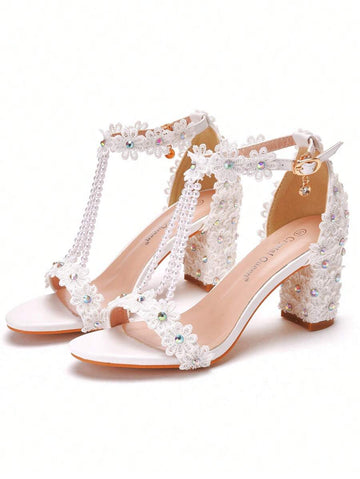 Step into summer charm with these Elegant White Lace Flower Block Heel Sandals! Featuring delicate lace and playful flower details, these open-toe chunky heels are perfect for brides who want comfort without sacrificing style. The sturdy block heel offers stability for dancing the night away, while the airy design keeps your feet cool. Celebrate your special day with a touch of whimsy and grace!