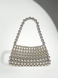 Add a touch of sparkle to your outfit with this Elegant White Pearl Beaded Shoulder Bag. Perfect for any occasion, its shimmering pearls and sleek design make it a playful yet sophisticated accessory that effortlessly elevates your style. Carry your essentials in chic fashion and turn heads wherever you go!