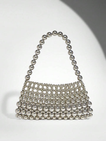 Add a touch of sparkle to your outfit with this Elegant White Pearl Beaded Shoulder Bag. Perfect for any occasion, its shimmering pearls and sleek design make it a playful yet sophisticated accessory that effortlessly elevates your style. Carry your essentials in chic fashion and turn heads wherever you go!