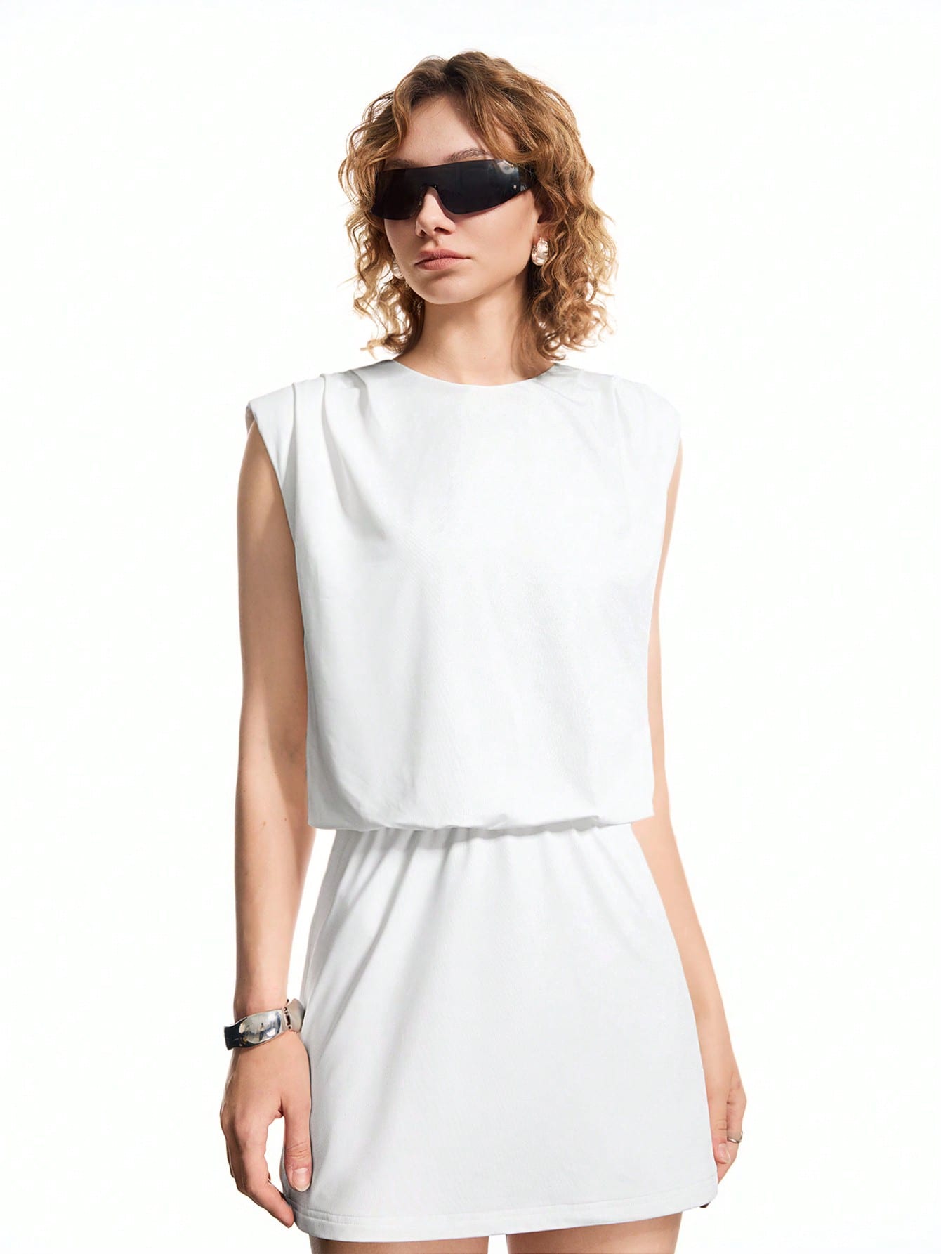 Step out in style with this Elegant White Round Neck Pleated Mini Dress, designed to keep your look fresh and fun. Its airy pleats add a playful bounce to every move, while the classic round neck keeps it effortlessly chic. Perfect for casual days or your daily commute, this dress blends comfort and charm for a wardrobe winner you’ll love to wear again and again.