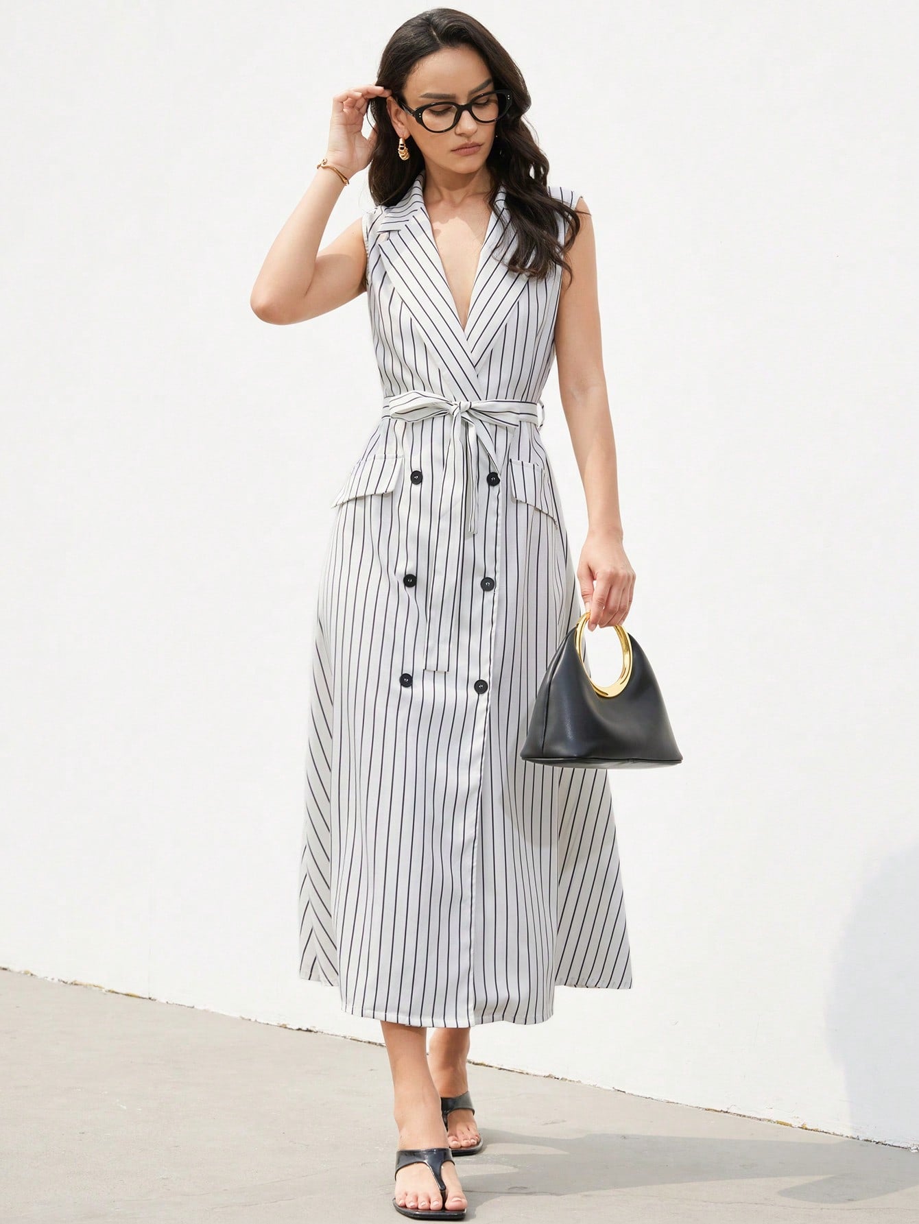 Step out in style with this elegant white striped long dress, designed for the fashion-forward woman who loves a playful twist. Featuring a chic double-breasted front and a flattering tie waist, it effortlessly combines sophistication with a fun, flirty vibe. Perfect for turning heads at any event or casual outing, this dress brings a fresh, confident flair to your wardrobe.