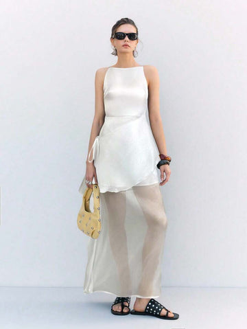 Step out in style with this playful white woven mini dress designed just for women who love a touch of elegance. Its sleeveless, round neck silhouette keeps things light and breezy, perfect for sunny days or lively evenings. The mini length adds a flirty vibe, making it a fun choice for any occasion where you want to shine effortlessly.