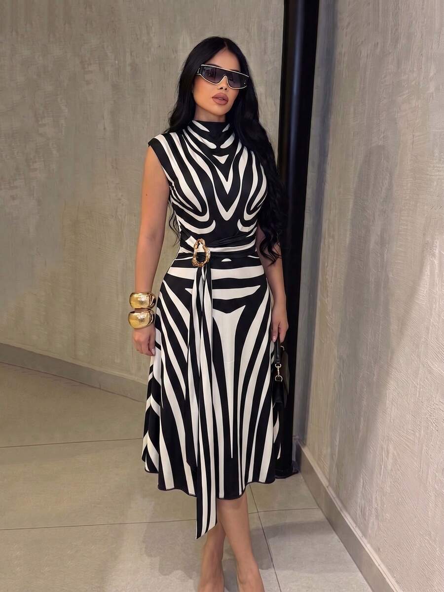 Front view of black and white zebra print belted midi dress with stand collar and gold-tone buckle belt