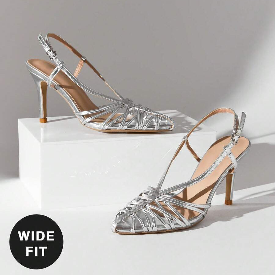 Elevate your everyday style with these sophisticated stiletto pumps, designed for the modern woman who refuses to compromise on comfort or elegance. The striking crisscross straps add a contemporary twist to the timeless pointed-toe silhouette, creating a flattering line that elongates the leg. Crafted with a generous wide fit, these pumps accommodate various foot widths without sacrificing the sleek aesthetic. The stiletto heel provides that coveted lift and confidence boost