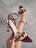 Step into the spotlight with these playful wine red leopard fur stiletto sandals. Perfect for nightclub nights and special occasions, their bold fur accents and sleek design add a fierce touch to any outfit. Elevate your look and dance the night away in style and confidence.