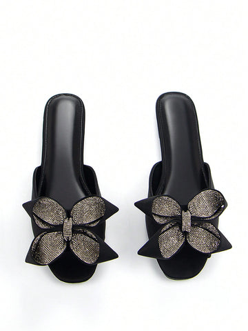 Step into style with our Wine Red Rhinestone Flower Bow Flat Mules! These sassy sandals bring the party wherever you go with their eye-catching rhinestone flower bow. Crafted from comfy Lycra that hugs your feet just right, they're your new BFFs for both casual days and nights out. Who says you can't dance all night in flats? These mules prove you absolutely can!