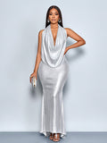 Turn heads in this stunning backless bodycon dress that effortlessly blends sophistication with sass. The draped neckline creates an elegant frame while the open back adds just the right amount of allure—perfect for making a statement at parties, weddings, or any occasion that calls for a show-stopping look. Designed to hug your curves in all the right ways, this chic piece transitions seamlessly from cocktail hour to dancing the night away. Slip it on and let your confidence do the talking!