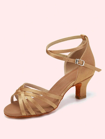 Elevate your ballroom experience with these sophisticated women's dance heels, designed for Latin and Salsa performances. Crafted from luxurious satin with a peep-toe silhouette, these mid-heel shoes feature a secure buckle closure and pyramid heel for optimal balance and support. The suedette outsole provides excellent grip on the dance floor, while the fabric lining and insole ensure comfort during extended wear. Available in elegant beige, these heels fit half-size larger for a perfect fit. Ideal for dan