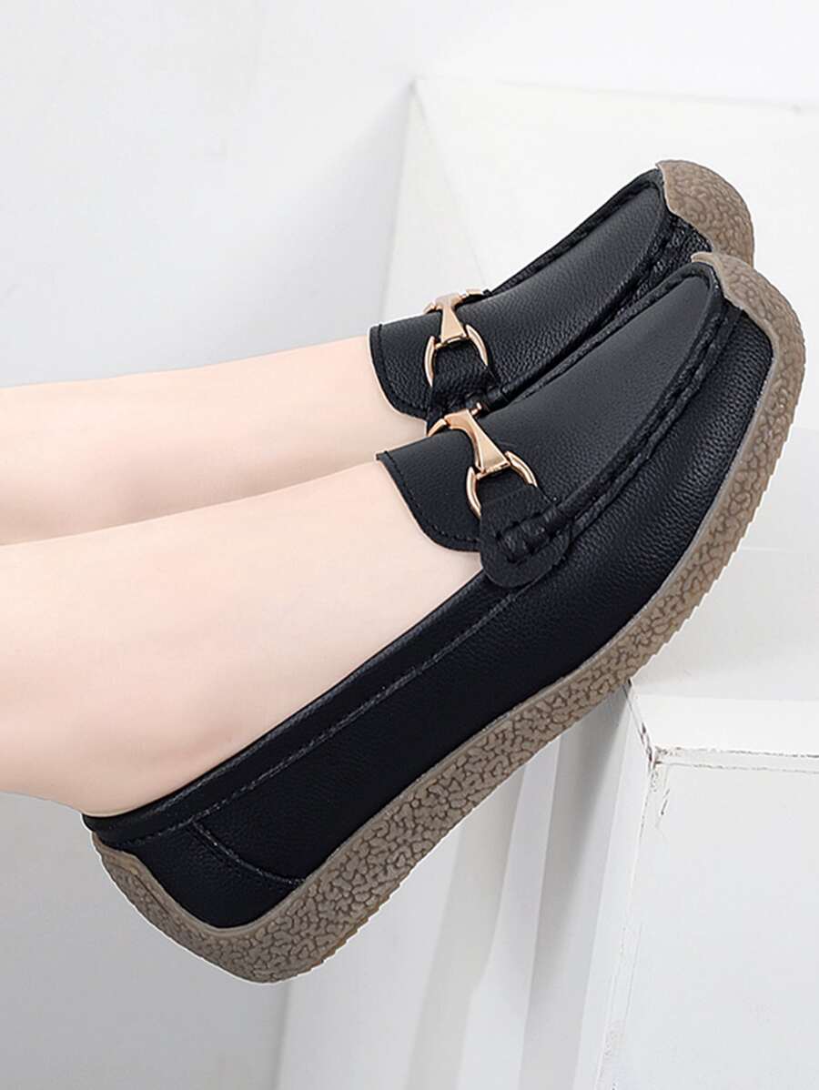 Step into effortless style with these chic black loafers that blend timeless elegance with modern comfort. Crafted from lightweight leather and finished with intricate hand stitching, each pair showcases meticulous attention to detail. The polished metal buckle adds a touch of sophistication, while the flat sole keeps you comfortable whether you're heading to the office or out for brunch. Perfect for anyone who refuses to compromise between looking put-together and feeling fabulous all day long.