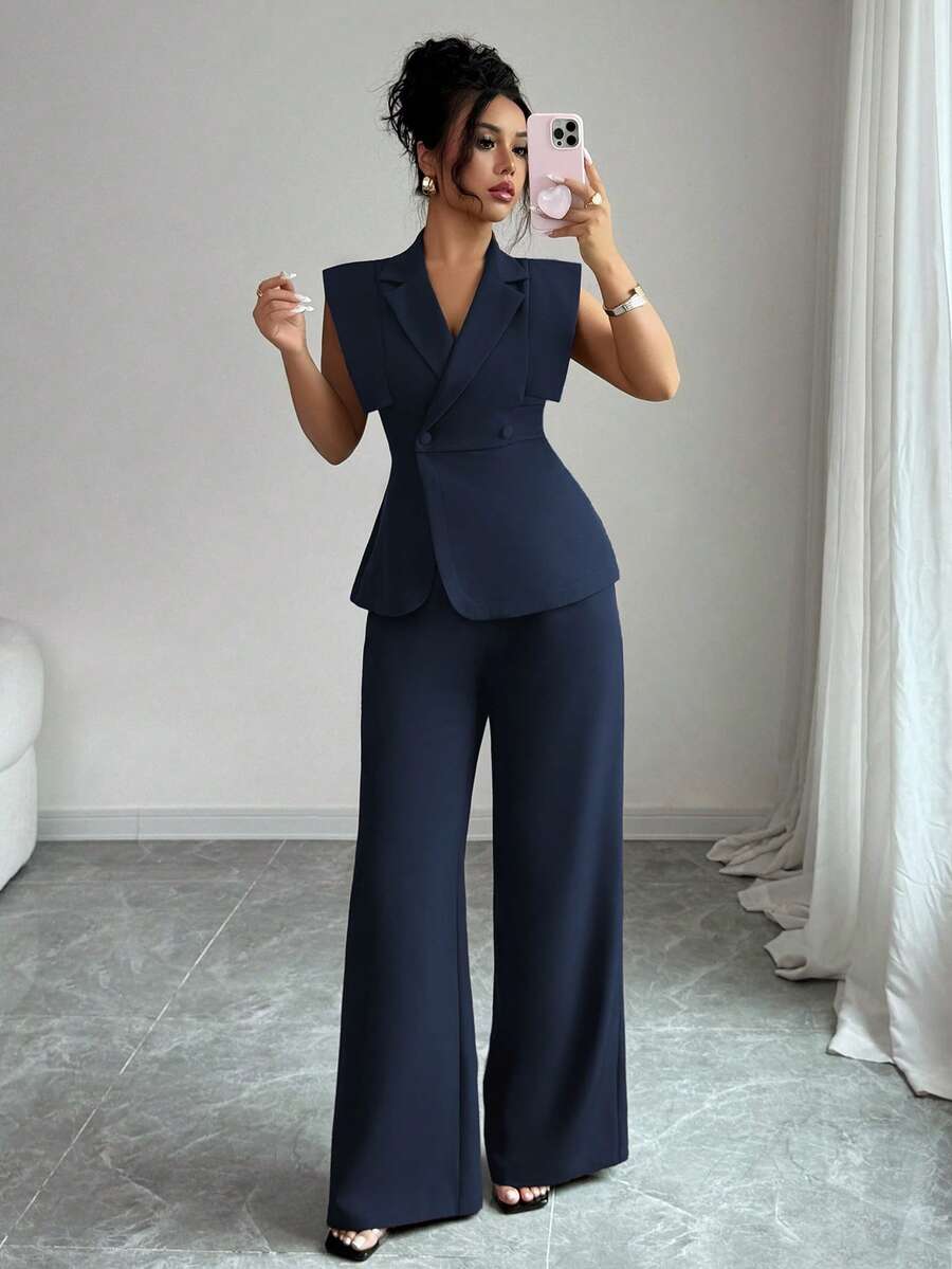 Elevate your wardrobe with this sophisticated two-piece suit set designed for modern professionals. The collared blouse features an asymmetrical cut with split sleeves and double-button detailing, while the elastic waist pants offer comfortable all-day wear. Crafted from a breathable polyester-elastane blend with slight stretch, this navy blue ensemble transitions seamlessly from office meetings to weekend getaways. The loose fit and lapel neckline create an effortlessly elegant silhouette perfect for work.