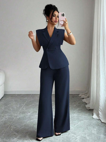 Elevate your wardrobe with this sophisticated two-piece suit set designed for modern professionals. The collared blouse features an asymmetrical cut with split sleeves and double-button detailing, while the elastic waist pants offer comfortable all-day wear. Crafted from a breathable polyester-elastane blend with slight stretch, this navy blue ensemble transitions seamlessly from office meetings to weekend getaways. The loose fit and lapel neckline create an effortlessly elegant silhouette perfect for work.
