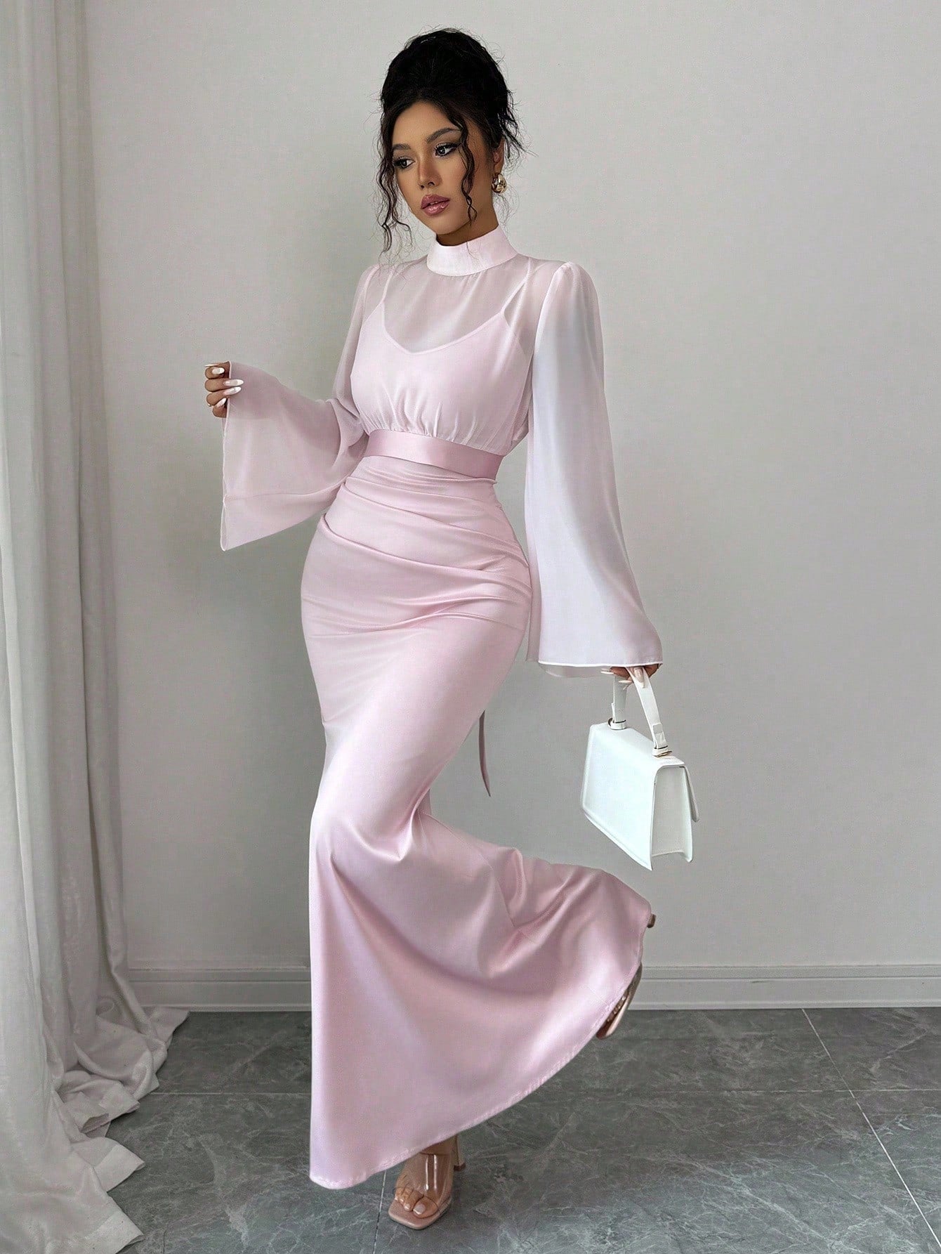 Step into autumn with effortless charm in this delightful two-piece set. The fitted camisole dress pairs perfectly with a sheer mesh shawl, creating a vintage-inspired silhouette that's equal parts cozy and chic. Whether you're layering for cooler days or draping the shawl for an instant style upgrade, this versatile ensemble captures that nostalgic retro vibe while keeping things refreshingly modern. Perfect for casual outings, weekend adventures, or whenever you want to feel put-together without trying to