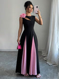 Elevate your wardrobe with this stunning dual-tone cutout floral dress. The high-low hemline creates a flattering silhouette while delicate cutout details add modern sophistication. Vibrant floral patterns blend beautifully across contrasting tones, making it perfect for weddings, date nights, or upscale casual events. The flowing design offers comfort without compromising elegance, ensuring you look polished from day to evening. A versatile piece that transitions seamlessly through any occasion.