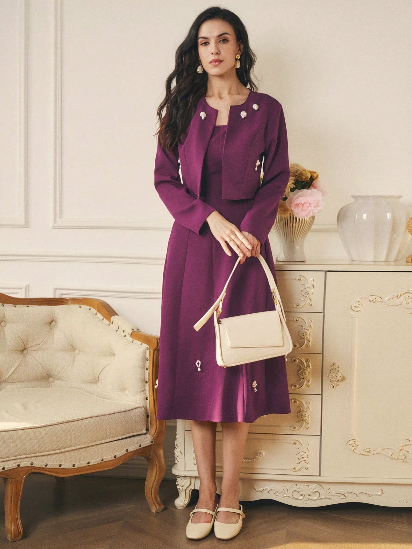 Be the epitome of elegance with this 2-piece set. The faux pearl long sleeve jacket adds a touch of class, while the square neck sleeveless dress exudes femininity. A stunning combination for any occasion. Shine on, darling.