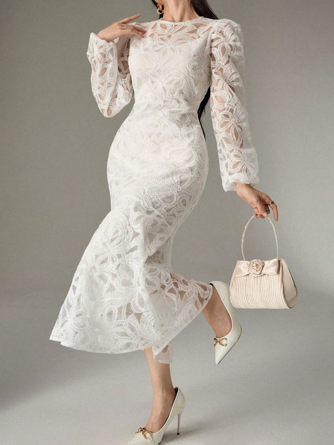 Elegantly designed, this women's dress features a unique fishtail hem and stylish bubble sleeves, perfect for any occasion. With its round neck, it provides a timeless and sophisticated look. Elevate your style with this versatile and chic dress.