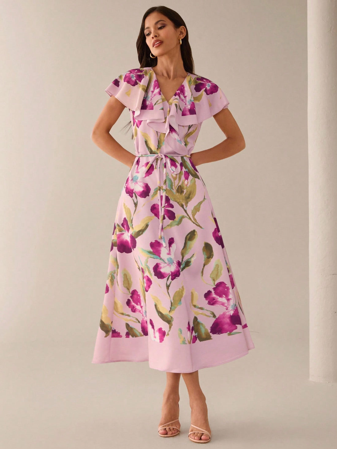 Step into sunshine with this playful mid-length summer dress, blooming in a charming orchid and hibiscus print. Its breezy fabric and flattering cut keep you cool and confident, perfect for garden parties, beach strolls, or casual days out. Embrace the season with effortless style and a splash of floral fun.