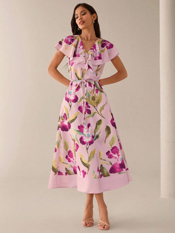 Step into sunshine with this playful mid-length summer dress, blooming in a charming orchid and hibiscus print. Its breezy fabric and flattering cut keep you cool and confident, perfect for garden parties, beach strolls, or casual days out. Embrace the season with effortless style and a splash of floral fun.