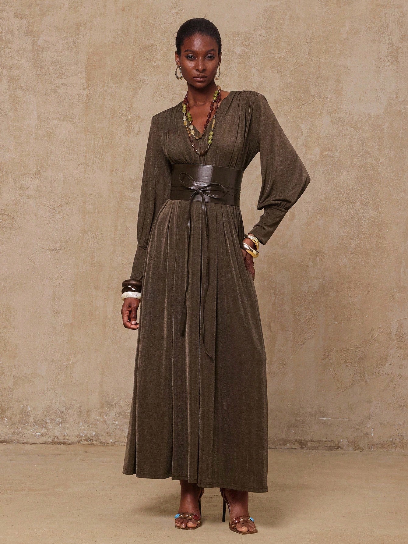 Step out in style this fall and winter with our Elegant Women's French Style Bodycon Maxi Dress. Featuring long sleeves and a daring deep V-neck, this dress hugs your curves for a flattering silhouette. Perfect for cozy evenings and festive events, it blends timeless French chic with modern sophistication. Get ready to turn heads and feel fabulous no matter the season!