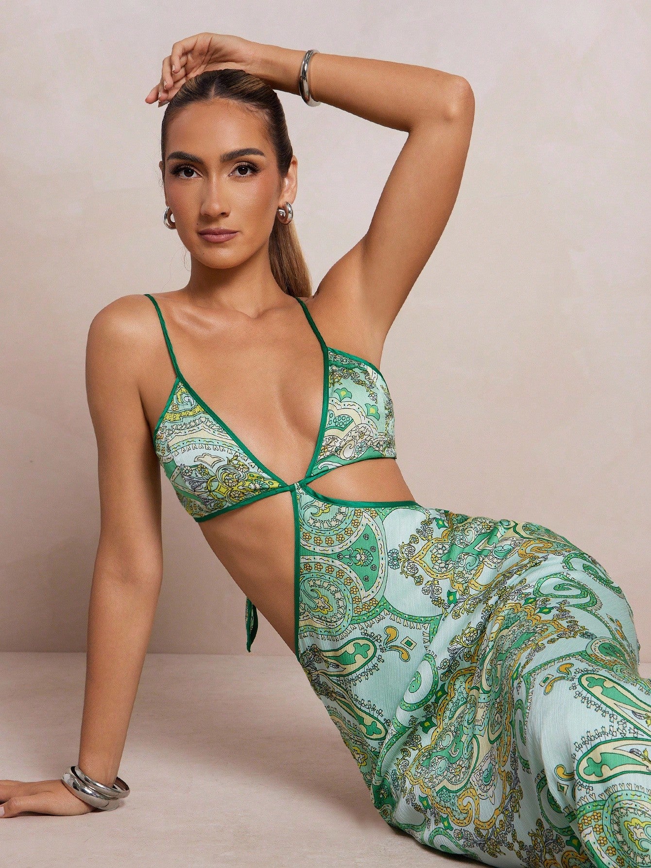 Step into effortless charm with this Elegant Women's Hollow-Out Maxi Shift Dress. Featuring delicate spaghetti straps and eye-catching hollow-out details, it’s perfect for turning heads at any occasion. Lightweight and breezy, this maxi dress combines comfort with style, making your look as playful as your spirit. Whether you’re out for a summer soirée or a casual day out, this dress keeps things fresh and flirty all day long.