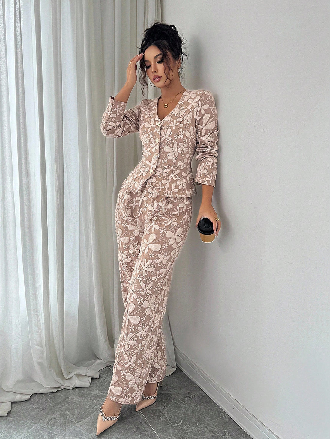 Elevate your wardrobe with this stunning jacquard long sleeve v-neck shirt set—where timeless elegance meets modern flair. Crafted with intricate jacquard detailing, this sophisticated piece features a flattering v-neckline and luxurious long sleeves perfect for layering or wearing solo. The refined texture adds visual interest to any outfit, making it ideal for both professional settings and elevated casual wear. Versatile, chic, and undeniably stylish, this set is your go-to for looking polished without t