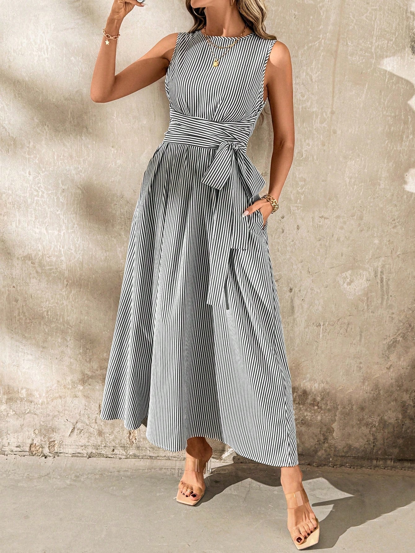 Get ready to turn heads with this versatile and playful Women's Linen Stripe Pocket Dress. With its elegant design and convenient pockets, you can effortlessly transition from casual outings to special occasions. The sleeveless style adds a touch of comfort and chicness, perfect for the fun-loving fashionista.
