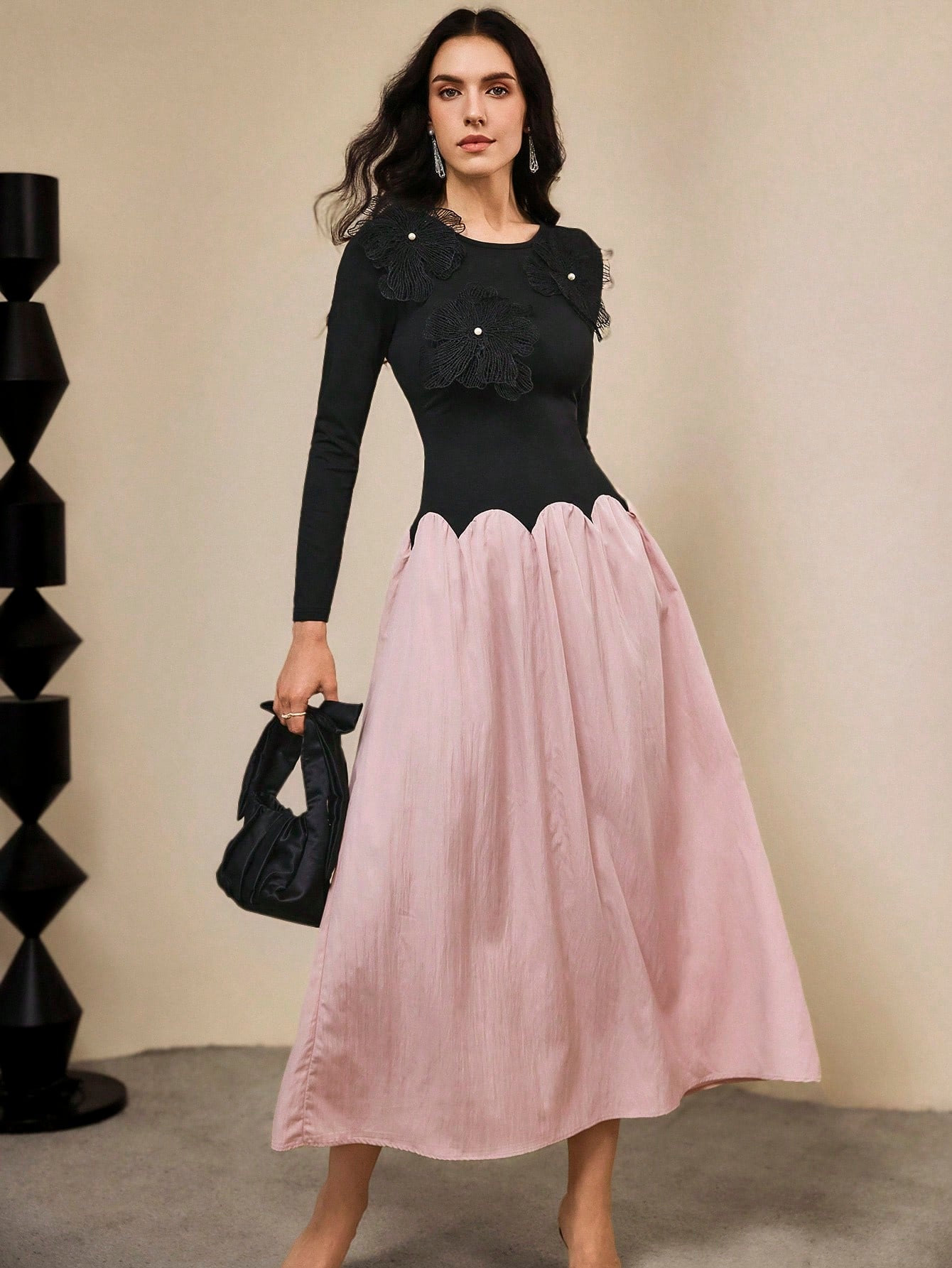 Make a statement in this stunning color block dress that perfectly blends sophistication with fun! Featuring a striking black and purple palette, this elegant piece showcases intricate 3D floral accents that add dimension and visual interest. The flowing silhouette is finished with a playful wavy hem that catches every step you take. Perfect for special occasions, evening events, or whenever you want to turn heads with effortless style. This dress proves that elegance doesn't have to be boring—it can be bol