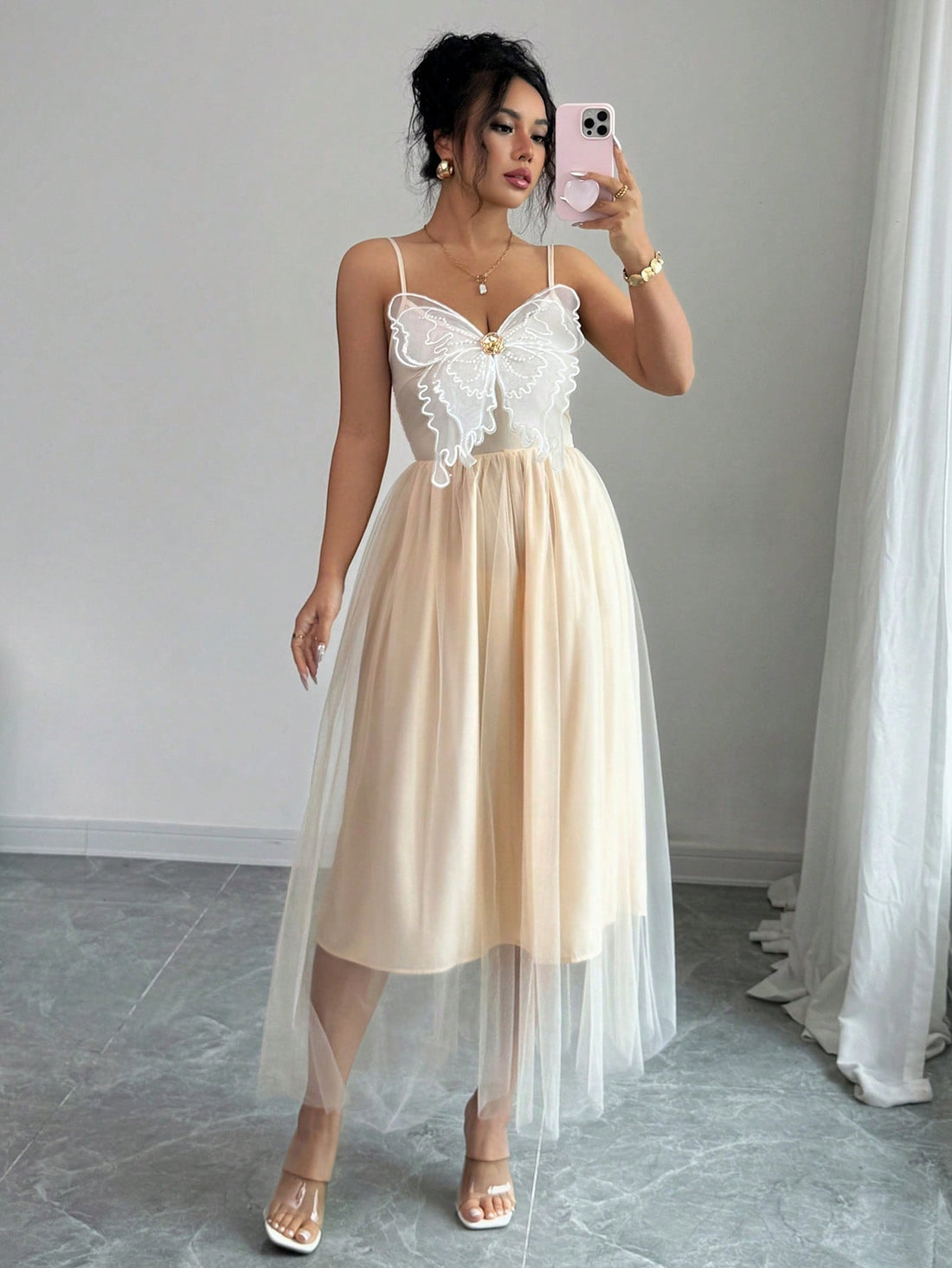 Step into charm and grace with this elegant long dress designed to delight. Featuring delicate butterfly embroidery and slender spaghetti straps, it adds a whimsical touch to your chic occasions. The flowing silhouette moves with you, ensuring you feel as fabulous as you look. Perfect for those moments when you want to flutter through the room effortlessly!