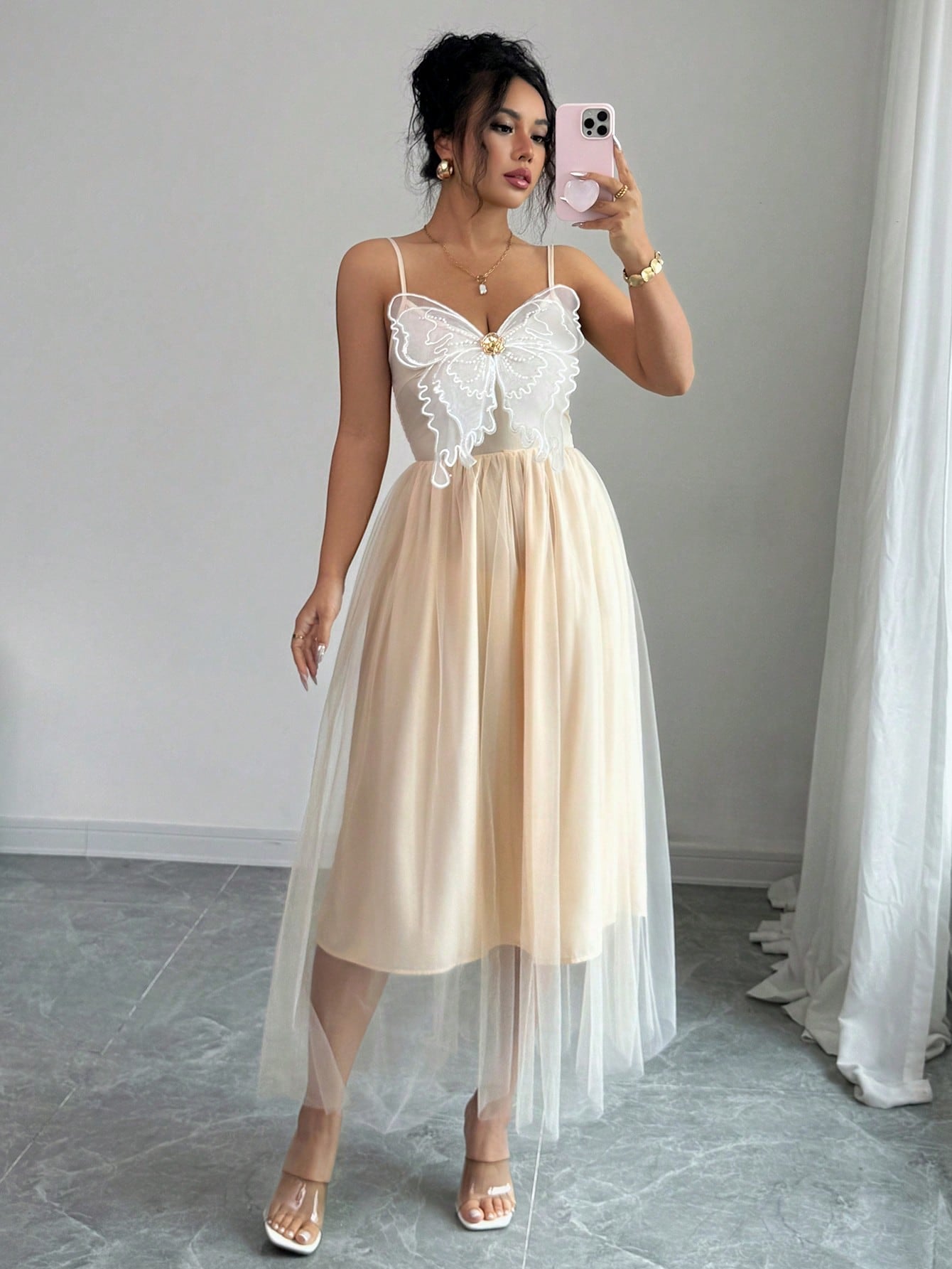 Step into charm and grace with this elegant long dress designed to delight. Featuring delicate butterfly embroidery and slender spaghetti straps, it adds a whimsical touch to your chic occasions. The flowing silhouette moves with you, ensuring you feel as fabulous as you look. Perfect for those moments when you want to flutter through the room effortlessly!