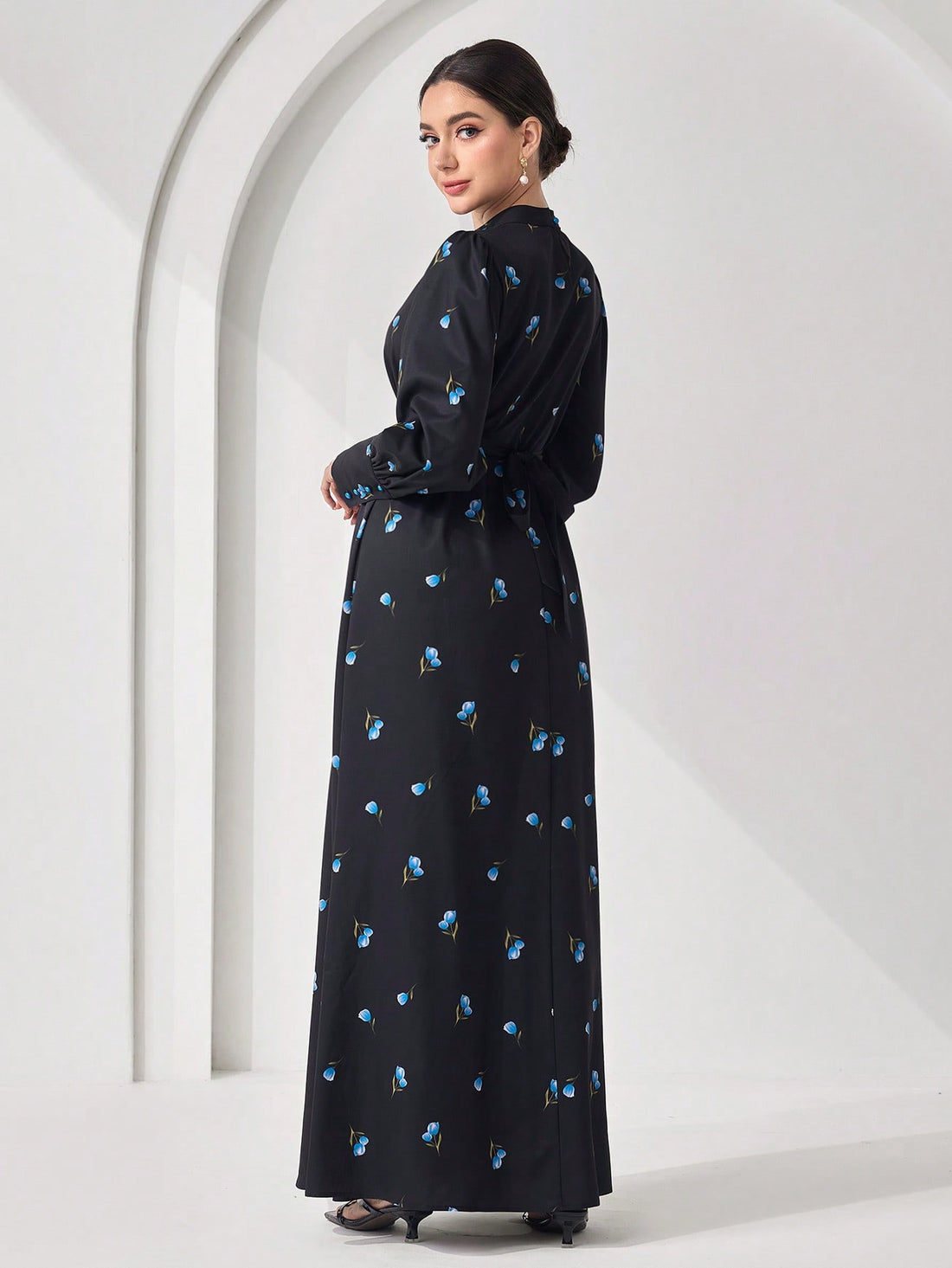 Effortlessly chic meets cultural flair in this stunning maxi dress that's basically a wearable work of art. The minimalist long sleeves keep things sophisticated while the all-over print adds personality and movement to every step. Perfect for those moments when you want to look polished without trying too hard—whether you're heading to a special event or just feeling fabulous on a regular Tuesday. This Arabic-inspired piece celebrates timeless elegance with a modern twist that'll have everyone asking where