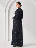 Effortlessly chic meets cultural flair in this stunning maxi dress that's basically a wearable work of art. The minimalist long sleeves keep things sophisticated while the all-over print adds personality and movement to every step. Perfect for those moments when you want to look polished without trying too hard—whether you're heading to a special event or just feeling fabulous on a regular Tuesday. This Arabic-inspired piece celebrates timeless elegance with a modern twist that'll have everyone asking where