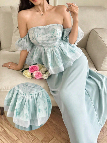 Elevate your wardrobe with this charming two-piece set that's equal parts sophisticated and fun. The off-shoulder top features delicate ruffles and a gorgeous plant print that brings nature-inspired elegance to your everyday style. Pair it with the flowing midi skirt for a complete look that transitions seamlessly from brunch to evening outings. Perfect for anyone who loves botanical vibes and effortless femininity. This set is your go-to for making a graceful impression without trying too hard.