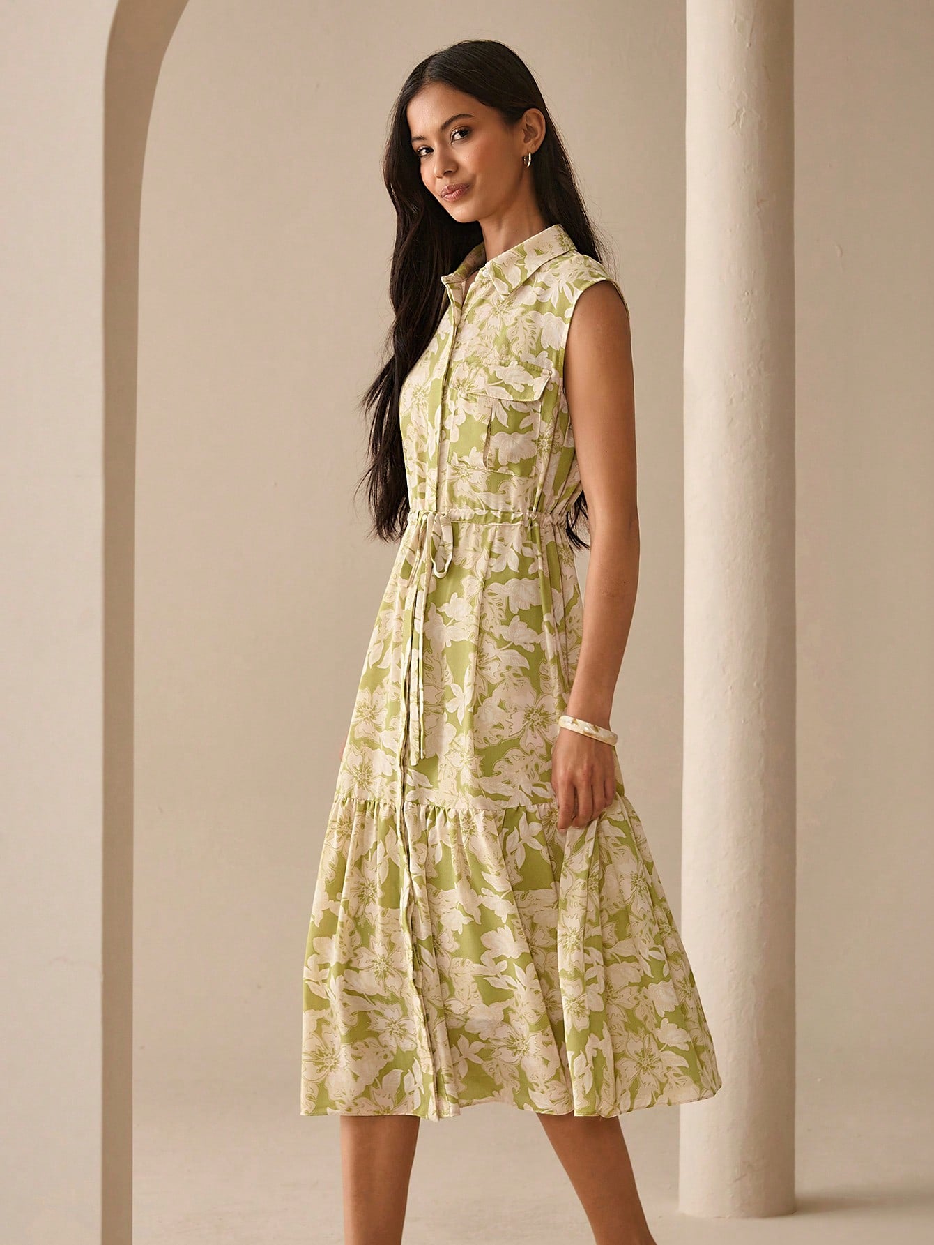 Step out in style with this playful and elegant midi shirt dress, perfect for sunny spring and summer days. Featuring a charming printed pattern, a cozy hood, and flattering ruching, it effortlessly blends comfort with chic. Whether you're heading to brunch or a casual outing, this dress adds a fun twist to your wardrobe while keeping you cool and confident.