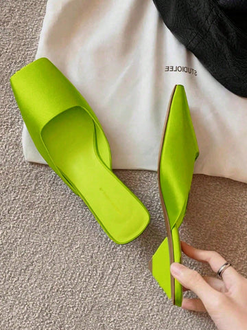 Step into timeless style with these stunning retro mules that blend vintage charm with modern comfort. Featuring a vibrant green hue that turns heads, these slip-on beauties boast a graceful low heel perfect for all-day wear. The backless design offers effortless elegance—just slip them on and go. Whether you're dressing up for brunch or keeping it casual, these versatile mules add a pop of personality to any outfit. Comfort meets sophistication in a shoe that's as fun to wear as it is fabulous to look at.