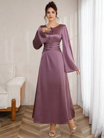 Slip into sophistication with this stunning shiny knit bodycon maxi dress that hugs your curves in all the right ways. The eye-catching tie-up shoulders add a flirty, modern twist, while luxurious long sleeves keep things elegant and refined. Perfect for date nights, special occasions, or whenever you want to turn heads, this dress combines comfort with undeniable glamour. The lustrous fabric catches the light beautifully, ensuring you'll shine from every angle. A wardrobe essential that proves you can be b