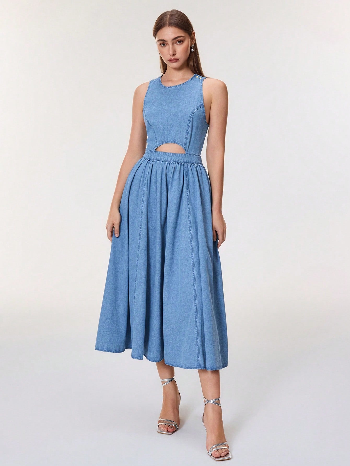Step into vacation mode with this playful sleeveless denim dress featuring chic cut-out details. Its lightweight fabric keeps you cool while the stylish design adds a fun, effortless vibe to your getaway wardrobe. Perfect for sunny days and spontaneous adventures, this dress combines comfort and flair for your best holiday look.