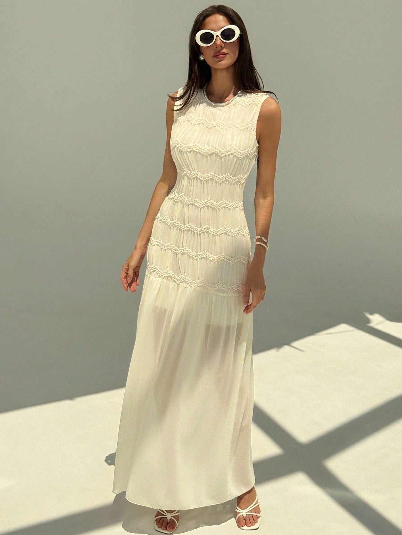 Turn heads with this Elegant Women's Sleeveless Mesh Patchwork Dress. Featuring a chic solid color and a flattering round neck, its playful mesh patchwork adds a flirty twist to any occasion. Lightweight and breezy, it’s perfect for dancing the night away or sparkling at your next summer party.