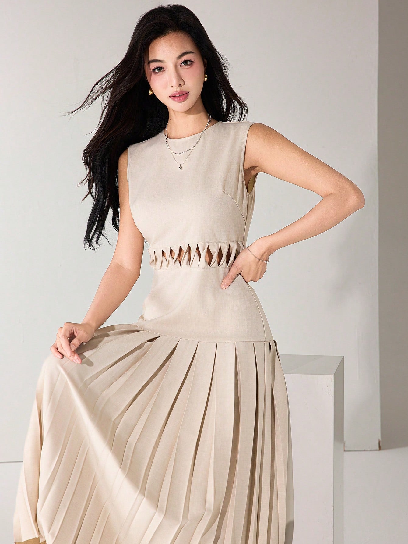 Twirl into summer with our sleeveless dress that's equal parts flirty and fabulous! The eye-catching hollow waist detail creates a stunning silhouette, while the playful pleated hem dances with every step. Perfect for turning heads at garden parties or making everyday errands feel like a runway moment!