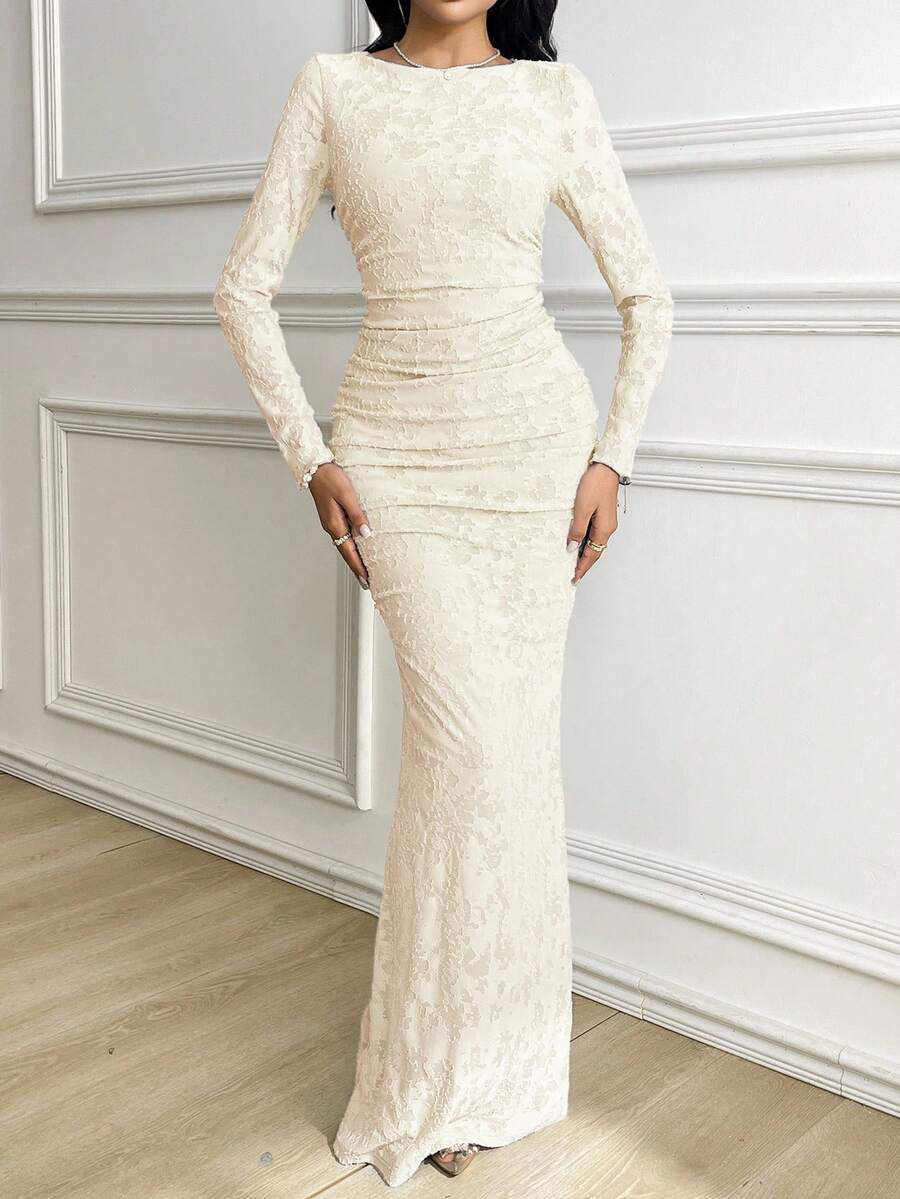 Elevate your wardrobe with this stunning jacquard dress that's equal parts sophisticated and fun. The fitted silhouette hugs you in all the right places, while delicate ruching adds dimension and movement to keep things interesting. Long sleeves and a classic round neckline make it perfect for any occasion—whether you're heading to brunch, the office, or a night out. The intricate jacquard fabric brings texture and visual appeal that'll have everyone asking where you got it. Dress it up with heels or keep i