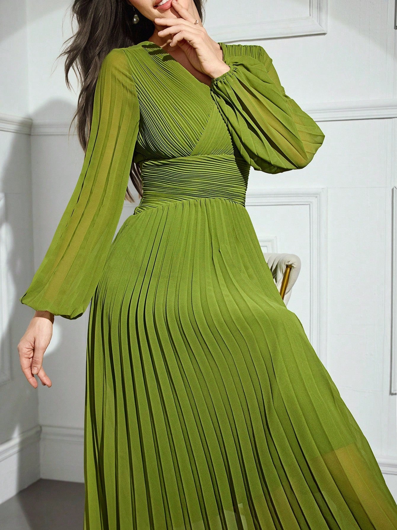 Wrap yourself in effortless elegance with this stunning midi dress that's equal parts sophisticated and fun. The flattering cross-wrap V-neck and pleated details create beautiful movement and dimension, while long sleeves keep things polished and timeless. Available in a classic solid color, this versatile piece transitions seamlessly from office to evening—just add your favorite accessories and you're ready to turn heads. Perfect for anyone who believes style should feel as good as it looks.