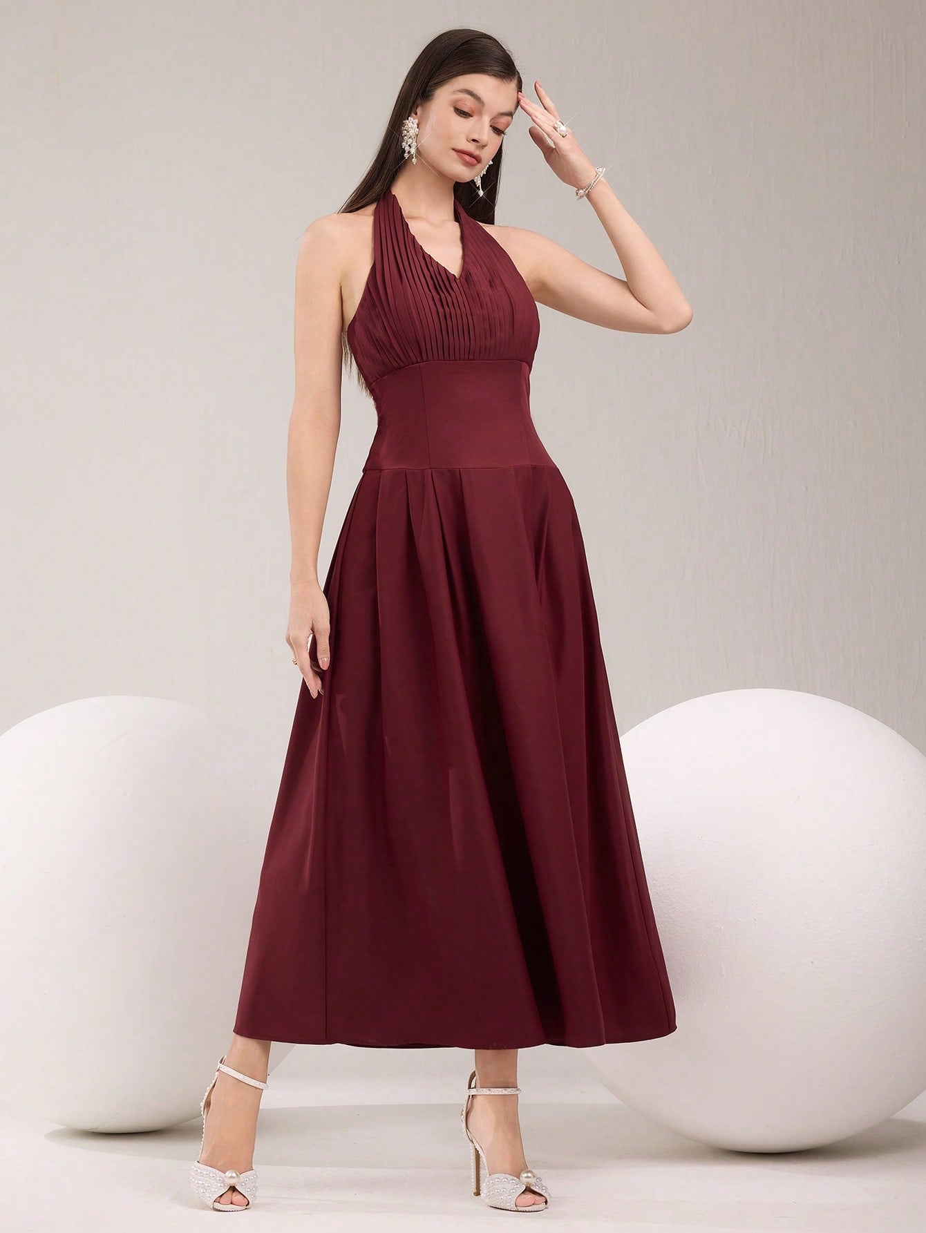 Dress to impress in our elegant pleated halter neck dress! With its solid color design and flattering silhouette, this dress is perfect for any occasion. Whether you're attending a wedding, party, or just want to feel chic and stylish, this dress has got you covered. Don't sacrifice comfort for style, this dress has both!