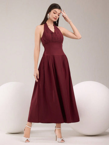 Dress to impress in our elegant pleated halter neck dress! With its solid color design and flattering silhouette, this dress is perfect for any occasion. Whether you're attending a wedding, party, or just want to feel chic and stylish, this dress has got you covered. Don't sacrifice comfort for style, this dress has both!