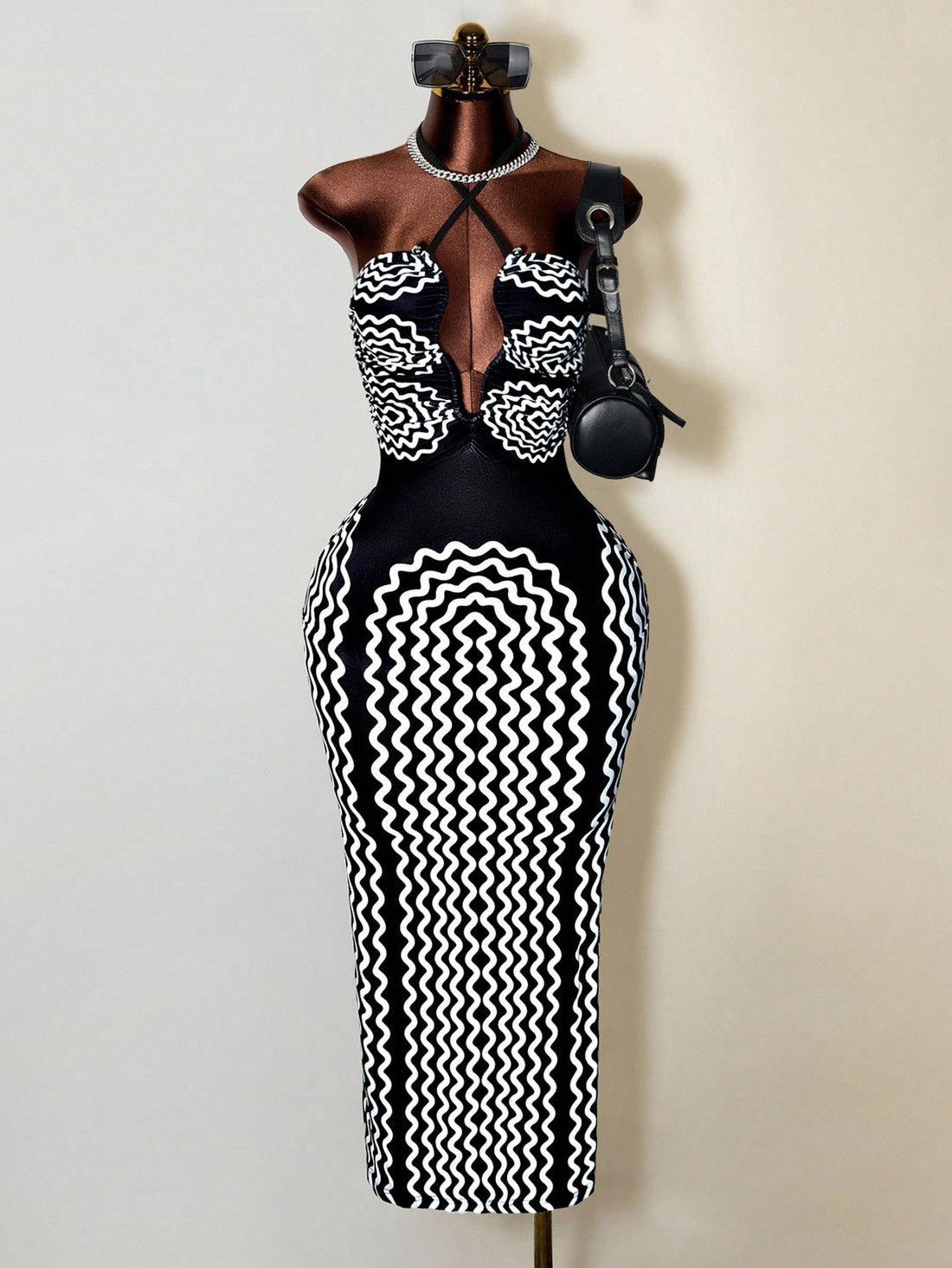 Turn heads with this playful yet elegant halter bodycon dress, featuring chic stripes and a flirty hollow-out design. The criss-cross neckline adds a fun twist, perfect for making a stylish statement at any event. Embrace your confidence in this figure-hugging dress that’s as charming as it is unique.